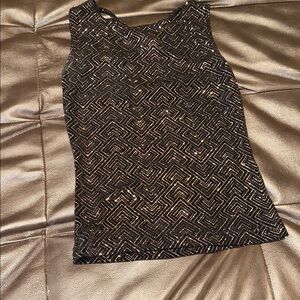 Shine in this crisscross detail back—size medium